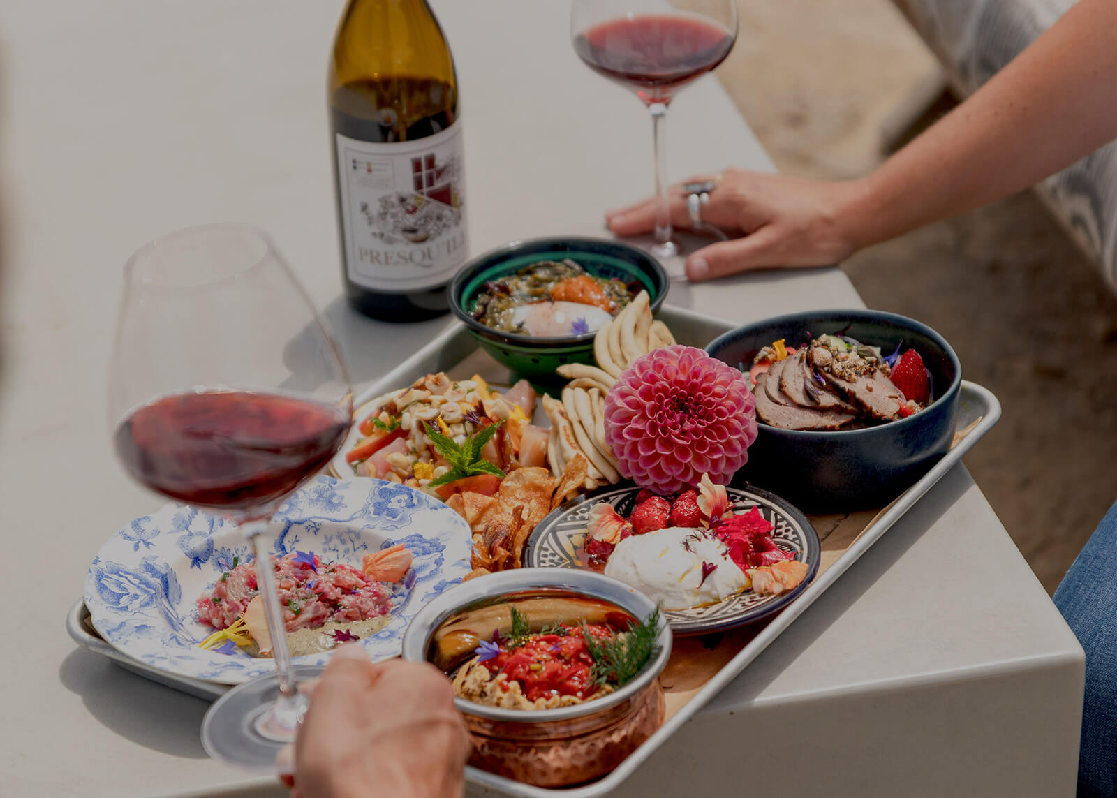 Restaurant Week Wine and tapas snacks in small bowls on an outdoor table in the Santa Ynez Valley