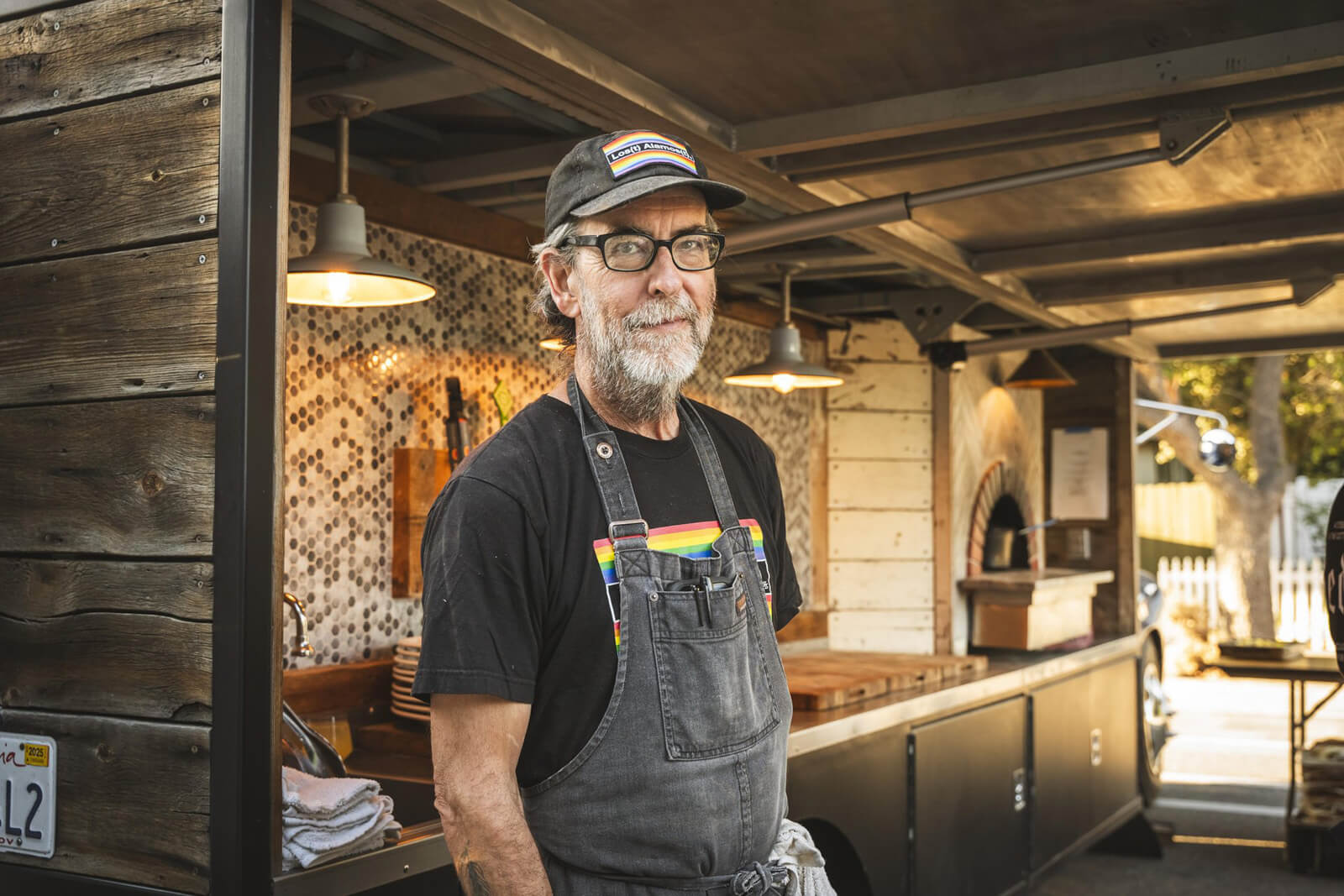 Los Alamos Man wearing an apron in a restaurant kitchen in Los Alamos, CA